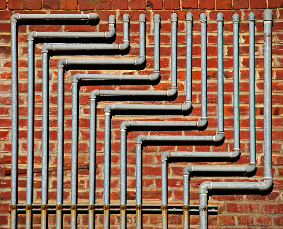 Pipes on a Brick Wall