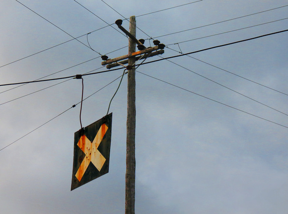 Telephone Pole and Train Crossing Sign