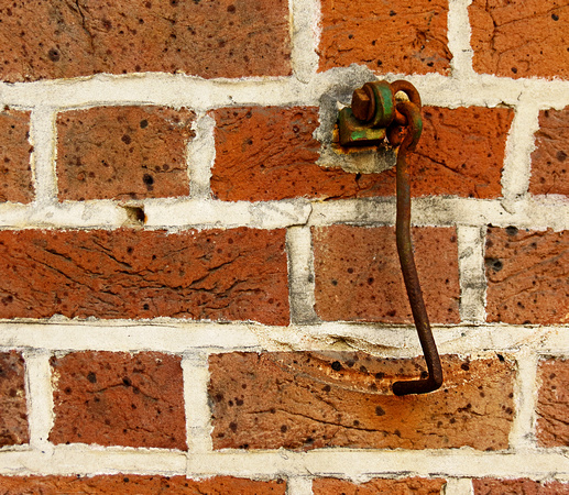 Latch Hook on Brick Wall
